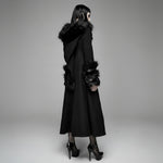 Black coat with fur trim on a gray background