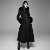 Black coat with fur trim worn by a model on a gray background